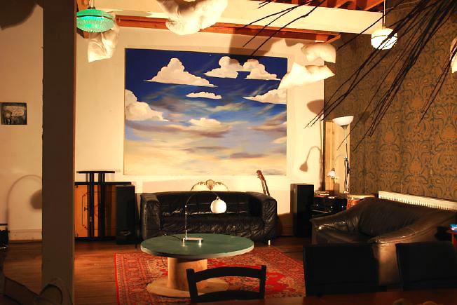 Bright, spacious 1,200 sq ft warehouse conversion with living area and studio space. The studio space is glass fronted with shutters and can be blacked out. NB- ceiling is now solid - no beams.