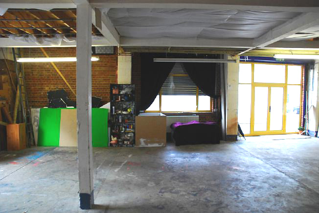 Bright, spacious 1,200 sq ft warehouse conversion with living area and studio space. The studio space is glass fronted with shutters and can be blacked out. NB- ceiling is now solid - no beams.