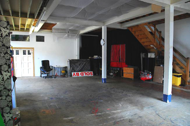 Bright, spacious 1,200 sq ft warehouse conversion with living area and studio space. The studio space is glass fronted with shutters and can be blacked out. NB- ceiling is now solid - no beams.