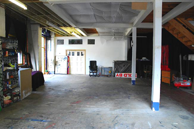 Bright, spacious 1,200 sq ft warehouse conversion with living area and studio space. The studio space is glass fronted with shutters and can be blacked out. NB- ceiling is now solid - no beams.