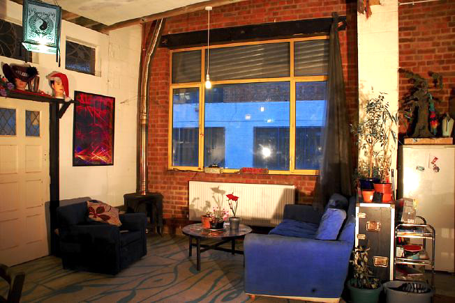 Bright, spacious 1,200 sq ft warehouse conversion with living area and studio space. The studio space is glass fronted with shutters and can be blacked out. NB- ceiling is now solid - no beams.