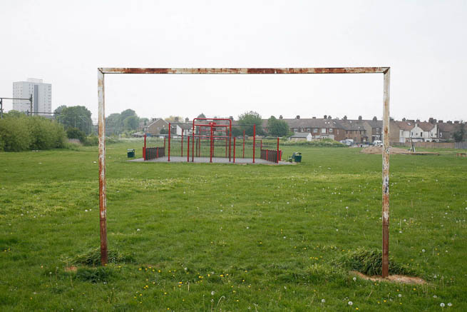 Football pitch on large recreation ground with great urban backdrop.