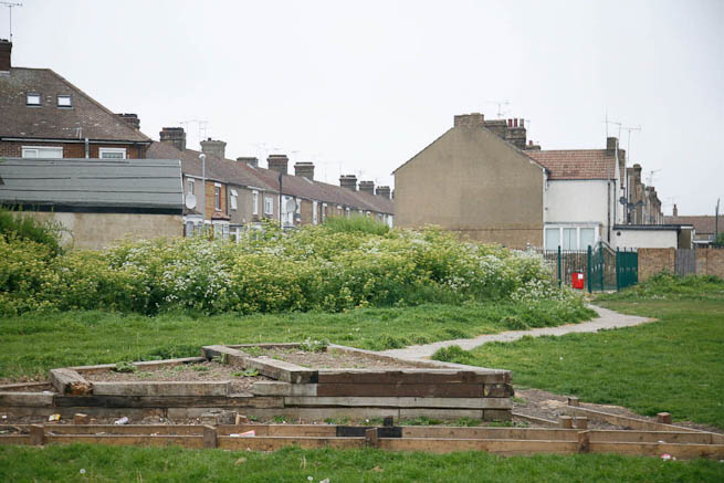 Football pitch on large recreation ground with great urban backdrop.