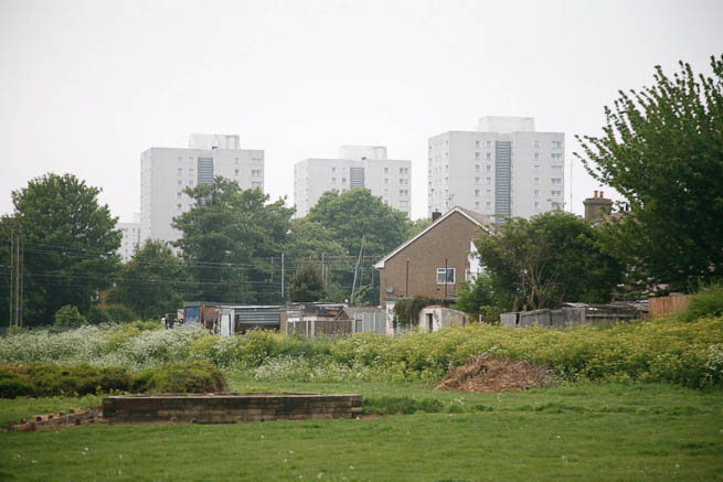 Football pitch on large recreation ground with great urban backdrop.