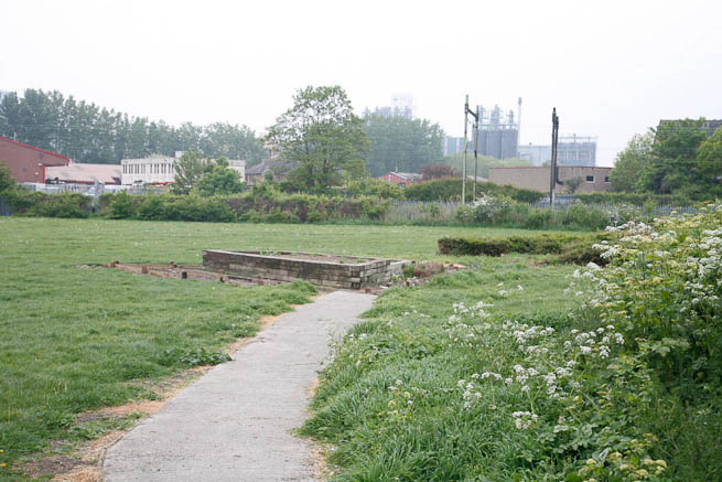 Football pitch on large recreation ground with great urban backdrop.