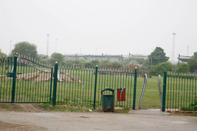 Football pitch on large recreation ground with great urban backdrop.