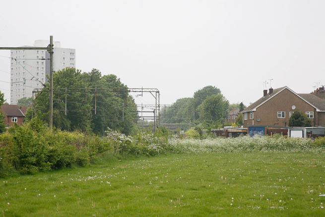 Football pitch on large recreation ground with great urban backdrop.