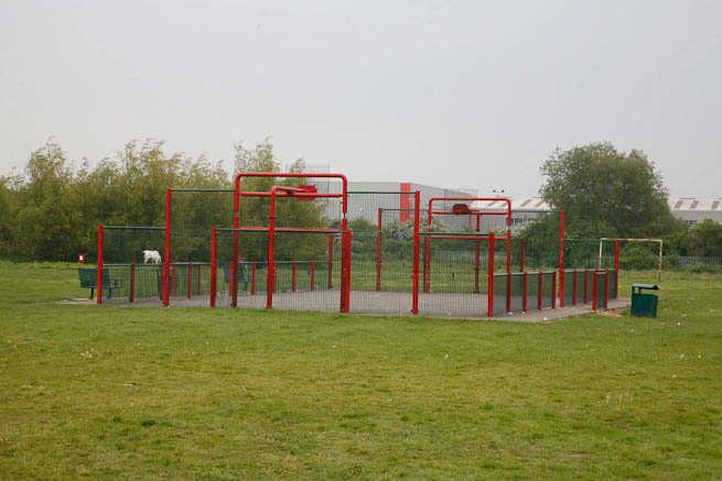 Football pitch on large recreation ground with great urban backdrop.