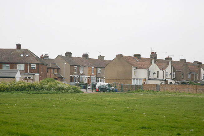 Football pitch on large recreation ground with great urban backdrop.