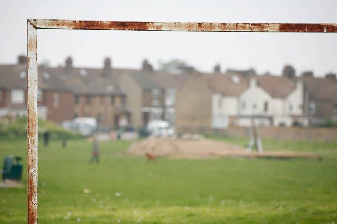 Football pitch on large recreation ground with great urban backdrop.