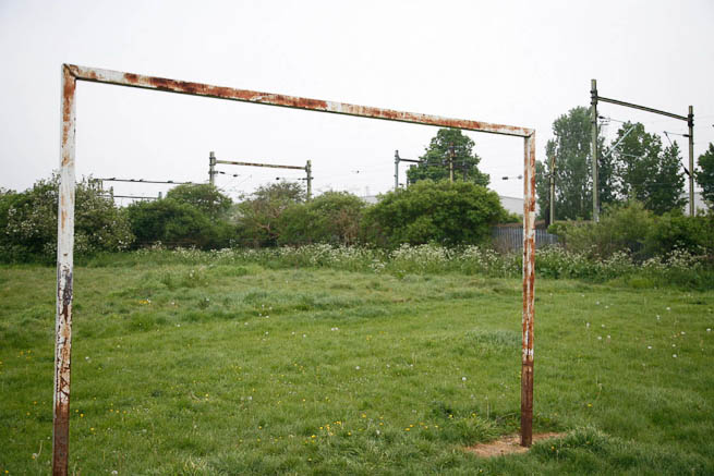 Football pitch on large recreation ground with great urban backdrop.