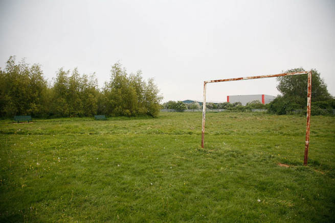 Football pitch on large recreation ground with great urban backdrop.