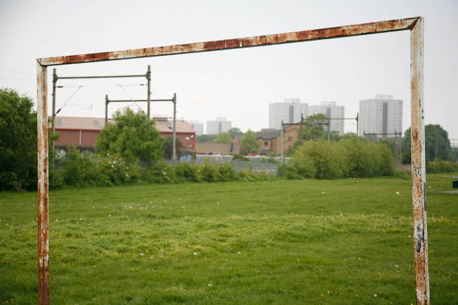 Football pitch on large recreation ground with great urban backdrop.