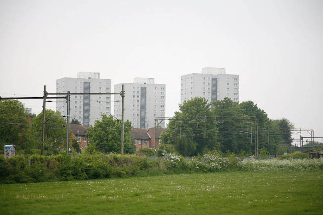 Football pitch on large recreation ground with great urban backdrop.