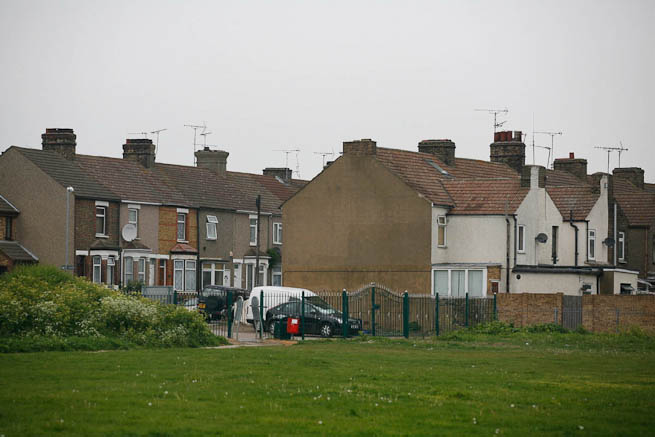 Football pitch on large recreation ground with great urban backdrop.