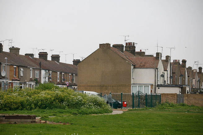 Football pitch on large recreation ground with great urban backdrop.