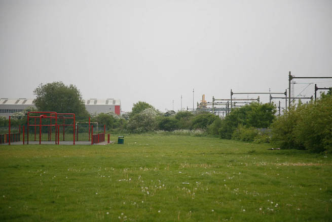 Football pitch on large recreation ground with great urban backdrop.