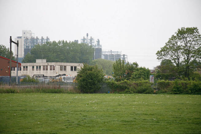 Football pitch on large recreation ground with great urban backdrop.