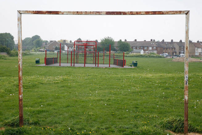 Football pitch on large recreation ground with great urban backdrop.