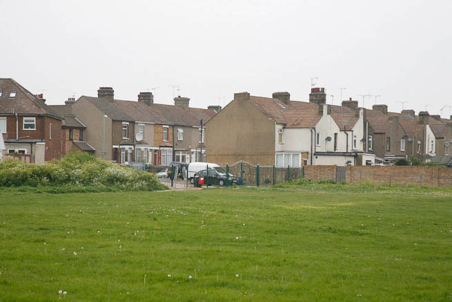Football pitch on large recreation ground with great urban backdrop.