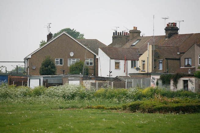 Football pitch on large recreation ground with great urban backdrop.