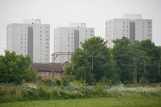 Football pitch on large recreation ground with great urban backdrop.