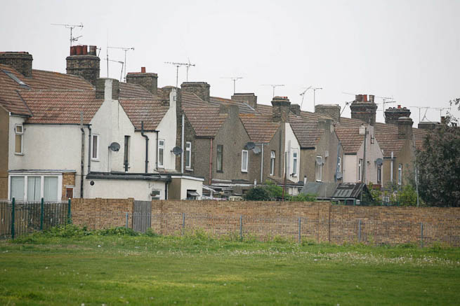 Football pitch on large recreation ground with great urban backdrop.