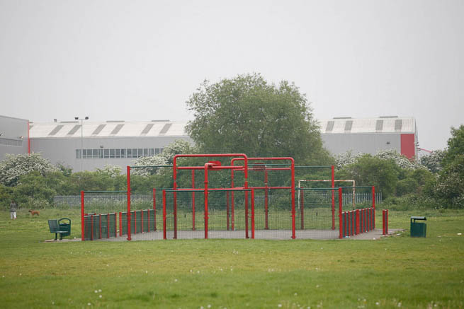Football pitch on large recreation ground with great urban backdrop.