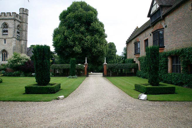 Driveways and entrance of a Tudor Manor house.