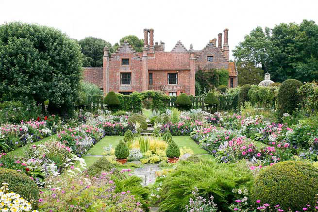 Gardens of a Tudor Manor house divided into compartments with different colour themes and structural forms.