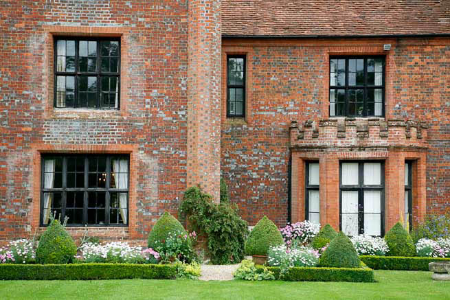 Gardens of a Tudor Manor house divided into compartments with different colour themes and structural forms.
