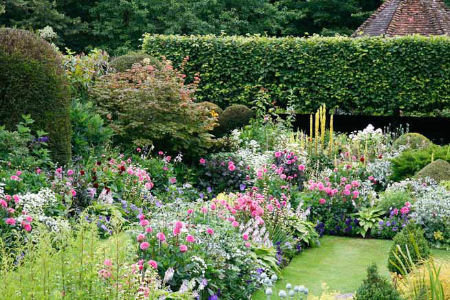 Gardens of a Tudor Manor house divided into compartments with different colour themes and structural forms.