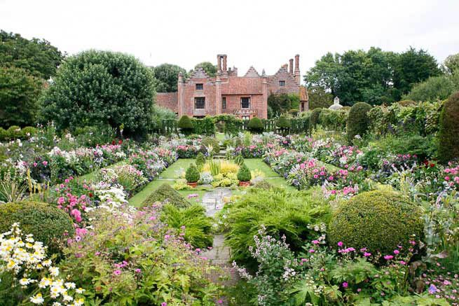 Gardens of a Tudor Manor house divided into compartments with different colour themes and structural forms.