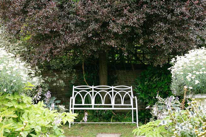 Gardens of a Tudor Manor house divided into compartments with different colour themes and structural forms.