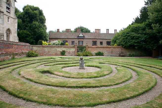 Gardens of a Tudor Manor house divided into compartments with different colour themes and structural forms.