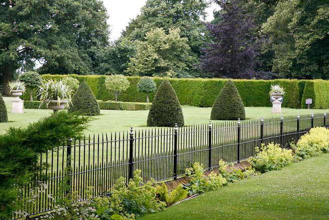 Gardens of a Tudor Manor house divided into compartments with different colour themes and structural forms.