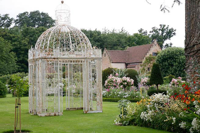 Gardens of a Tudor Manor house divided into compartments with different colour themes and structural forms.