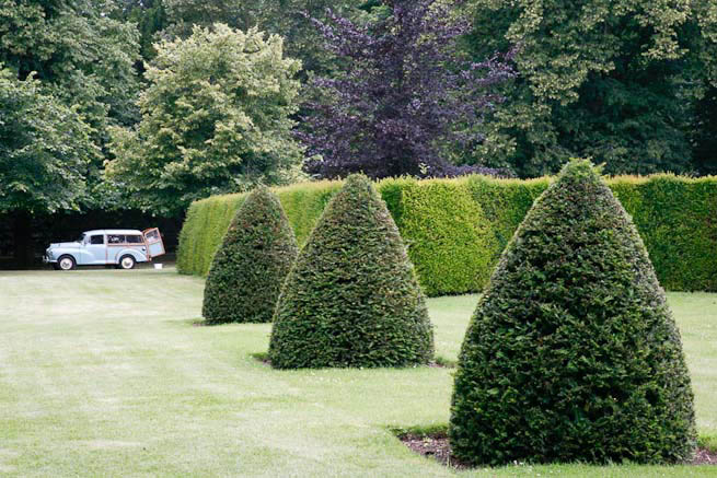 Gardens of a Tudor Manor house divided into compartments with different colour themes and structural forms.