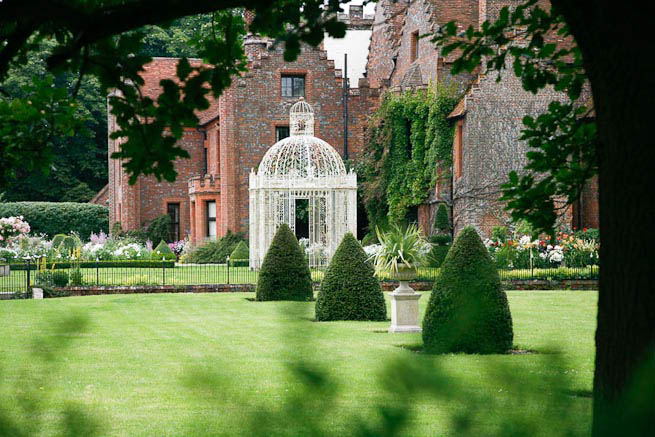 Gardens of a Tudor Manor house divided into compartments with different colour themes and structural forms.
