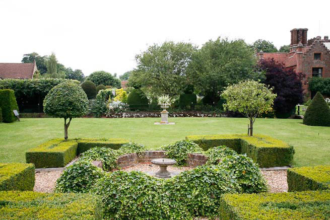 Gardens of a Tudor Manor house divided into compartments with different colour themes and structural forms.