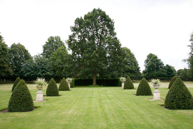 Gardens of a Tudor Manor house divided into compartments with different colour themes and structural forms.