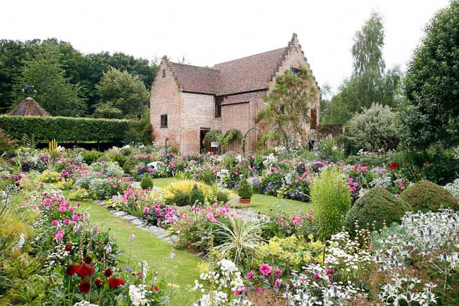Gardens of a Tudor Manor house divided into compartments with different colour themes and structural forms.