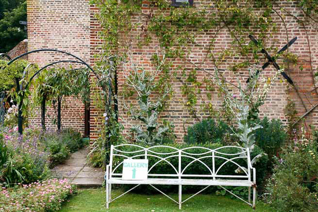Gardens of a Tudor Manor house divided into compartments with different colour themes and structural forms.