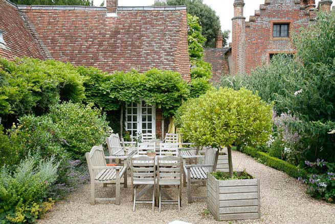 Gardens of a Tudor Manor house divided into compartments with different colour themes and structural forms.