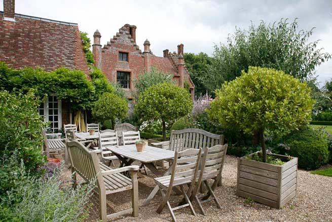Gardens of a Tudor Manor house divided into compartments with different colour themes and structural forms.