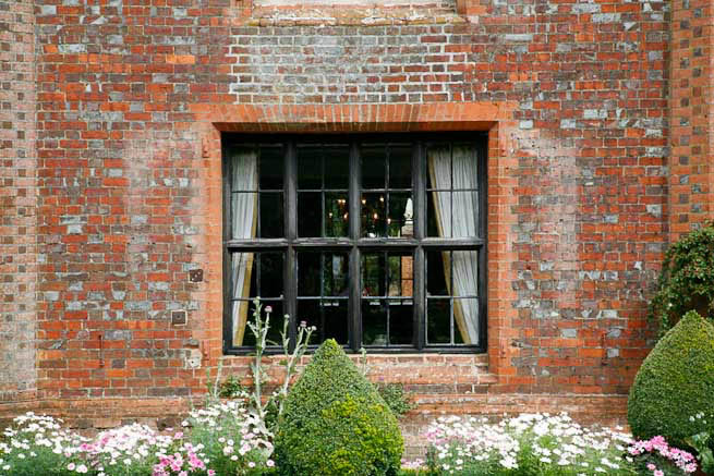 Gardens of a Tudor Manor house divided into compartments with different colour themes and structural forms.