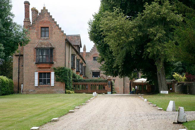 Gardens of a Tudor Manor house divided into compartments with different colour themes and structural forms.