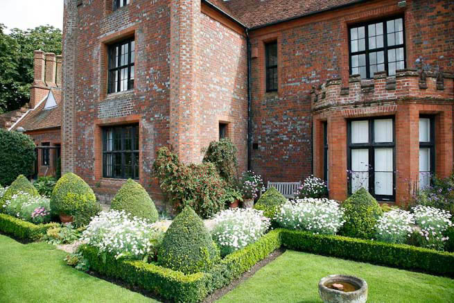 Gardens of a Tudor Manor house divided into compartments with different colour themes and structural forms.