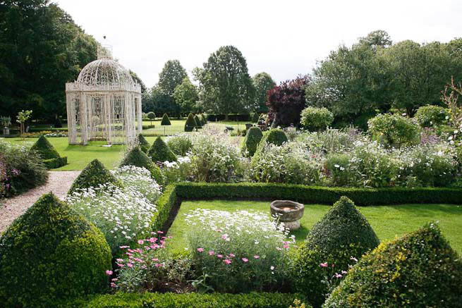 Gardens of a Tudor Manor house divided into compartments with different colour themes and structural forms.