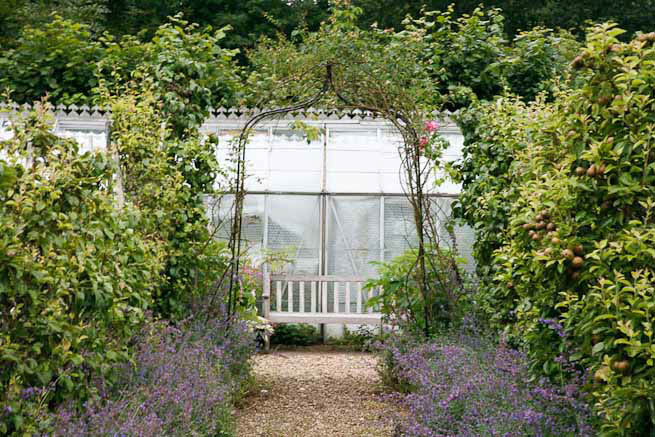 Gardens of a Tudor Manor house divided into compartments with different colour themes and structural forms.